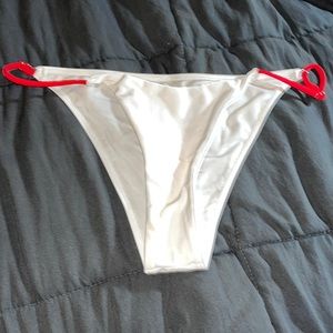 White bikini bottoms with red side adjustable strings